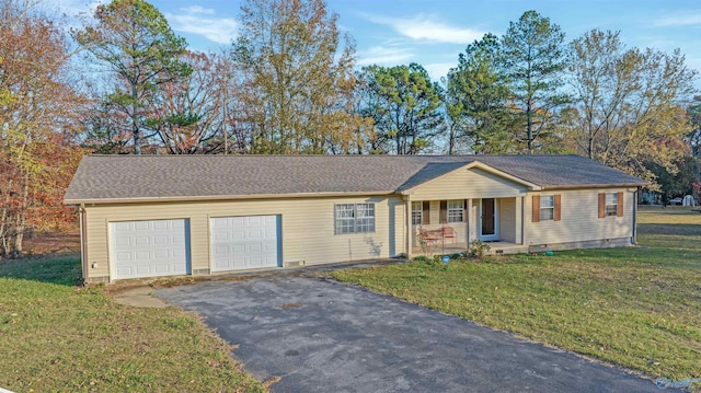 ranch-style home with a front yard, a garage, and covered porch