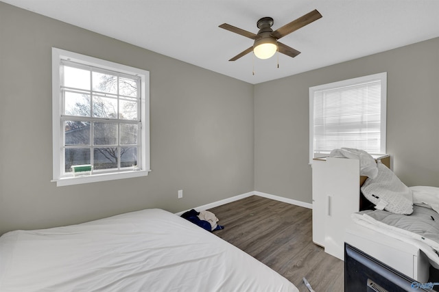 bedroom with ceiling fan and wood-type flooring