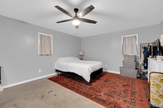 bedroom featuring dark carpet and ceiling fan