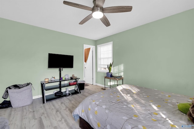 bedroom featuring light hardwood / wood-style flooring and ceiling fan