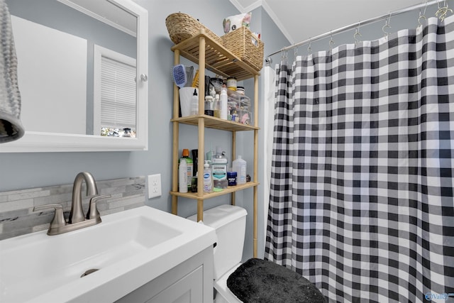 bathroom with vanity, curtained shower, toilet, and ornamental molding