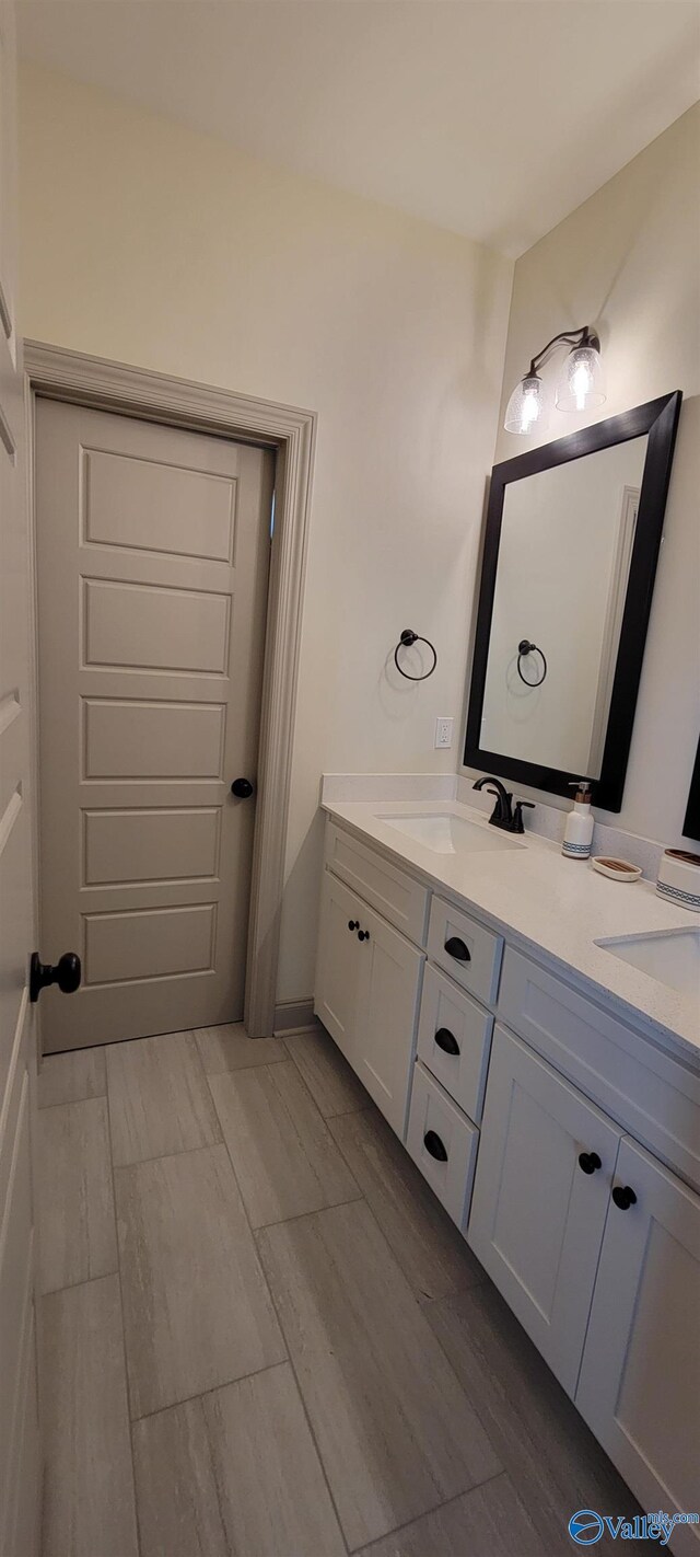 bathroom featuring vanity and hardwood / wood-style flooring