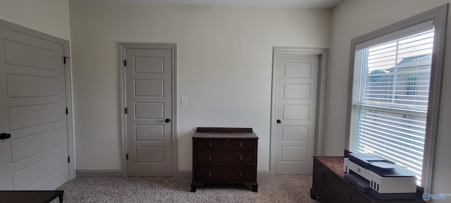 bedroom featuring light colored carpet