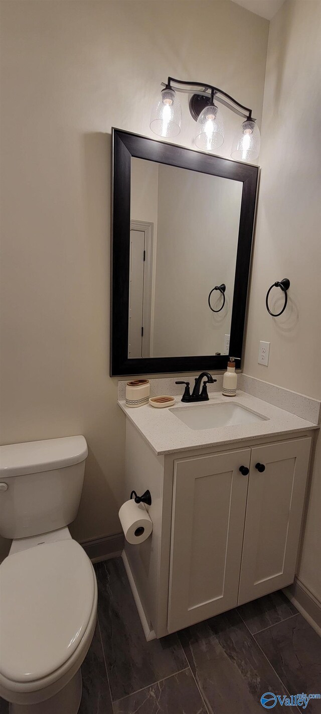 bathroom with vanity and toilet