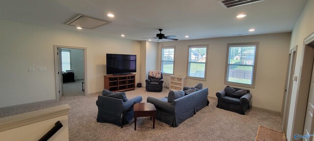 living room featuring ceiling fan and light colored carpet