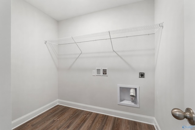 clothes washing area with dark wood-type flooring, hookup for an electric dryer, and hookup for a washing machine