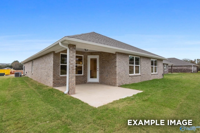 rear view of property featuring a patio area, cooling unit, and a lawn