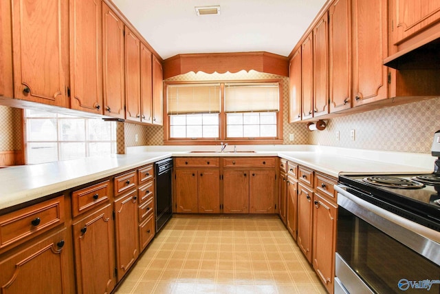 kitchen featuring dishwasher, decorative backsplash, stainless steel stove, and sink