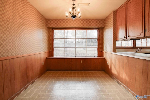 interior space featuring a notable chandelier and sink