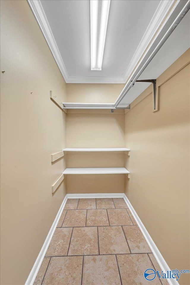 spacious closet featuring tile patterned flooring