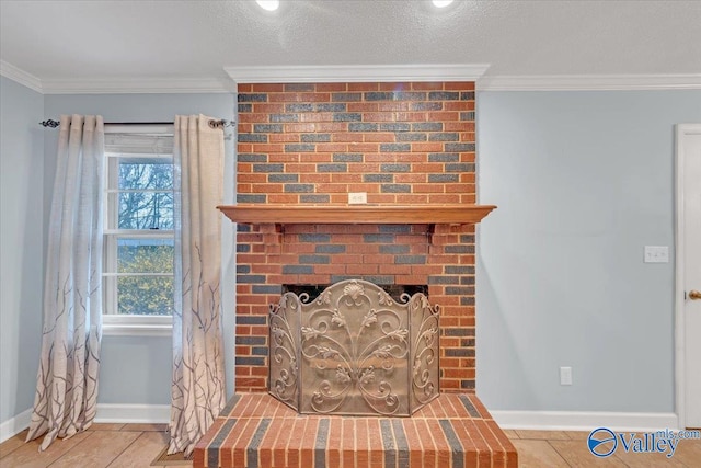 room details with a textured ceiling, ornamental molding, a brick fireplace, and baseboards