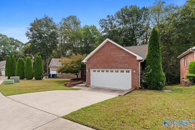 ranch-style home featuring a garage and a front lawn