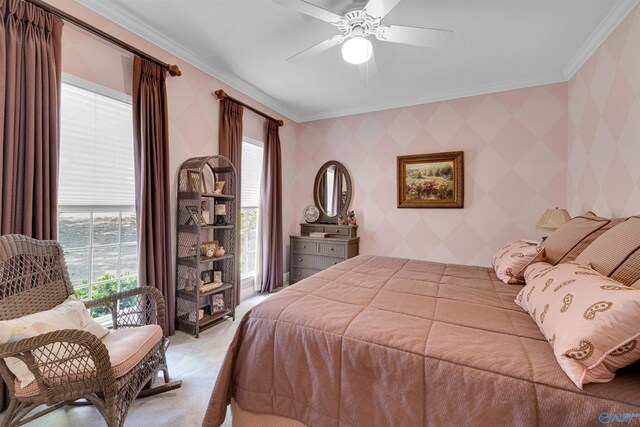 bedroom featuring carpet floors, crown molding, and ceiling fan