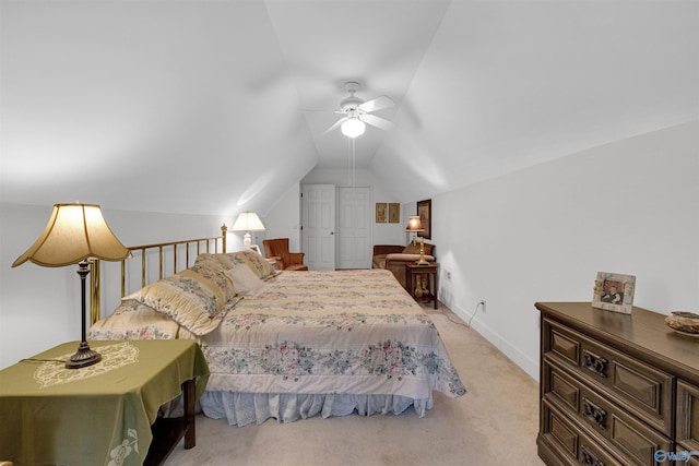 carpeted bedroom with ceiling fan and lofted ceiling