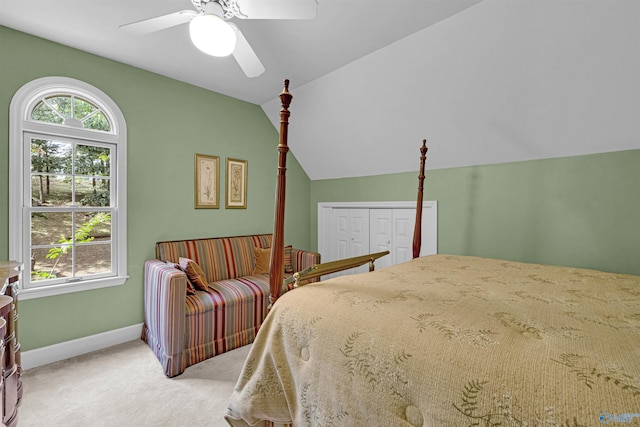 carpeted bedroom with ceiling fan and lofted ceiling