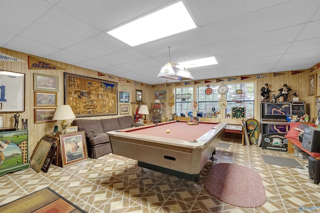 playroom featuring billiards, a paneled ceiling, and wood walls