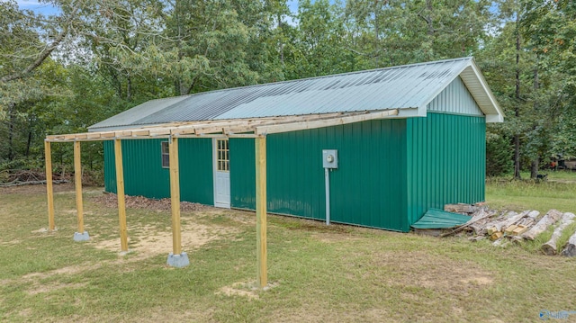 view of outdoor structure with a lawn