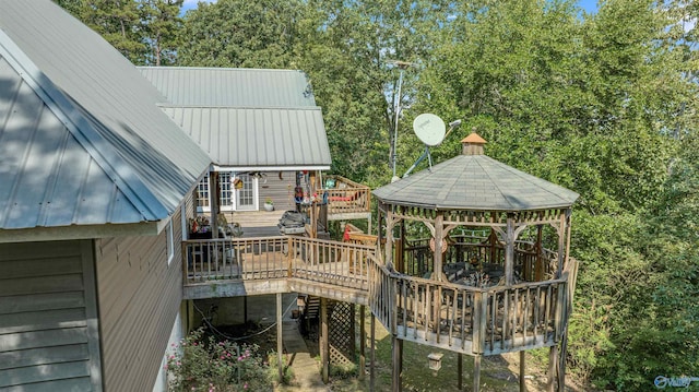 wooden terrace featuring a gazebo