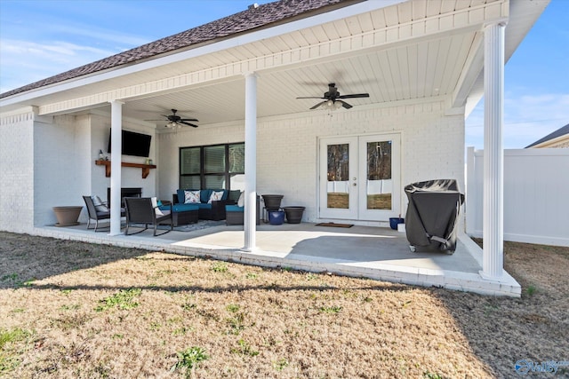 rear view of property featuring an outdoor living space, ceiling fan, a patio area, and french doors