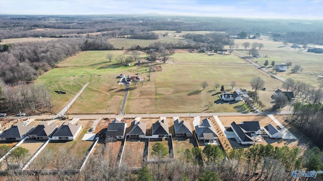 birds eye view of property with a rural view