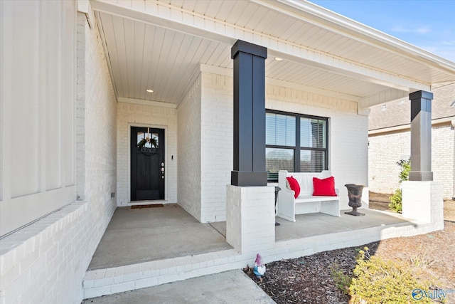 property entrance with covered porch