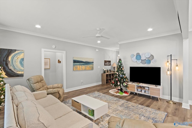 living room with crown molding, hardwood / wood-style floors, and ceiling fan