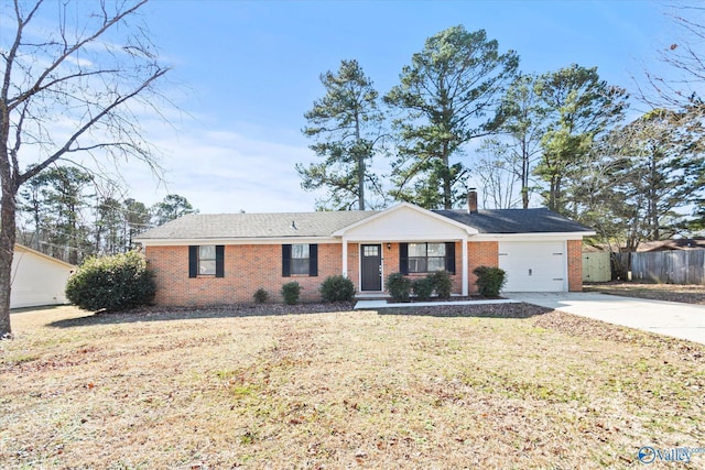 ranch-style home featuring a garage and a front lawn