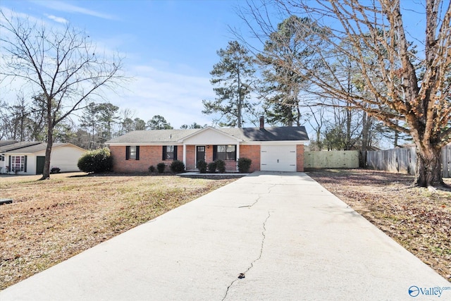 single story home featuring a garage and a front yard