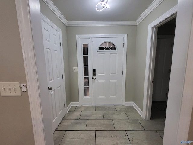 entryway with baseboards and ornamental molding