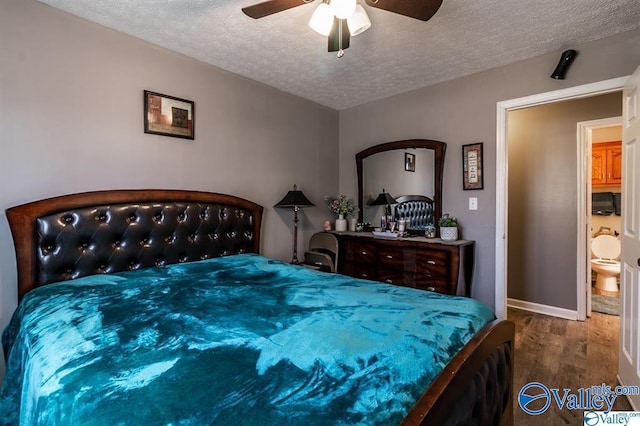 bedroom featuring a textured ceiling, baseboards, ceiling fan, and wood finished floors