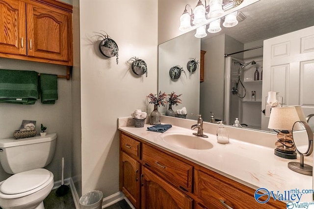 full bathroom with a textured ceiling, a shower, baseboards, toilet, and vanity