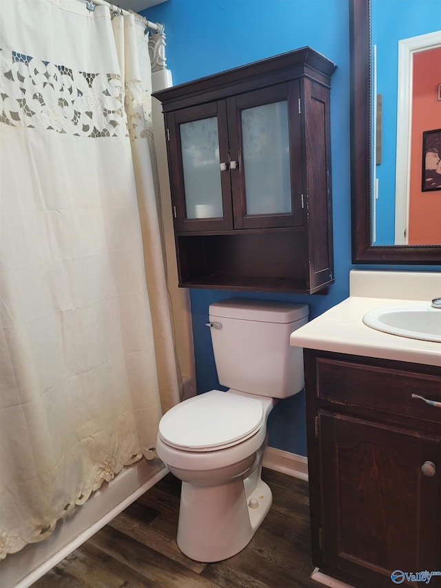 bathroom featuring hardwood / wood-style flooring, vanity, and toilet