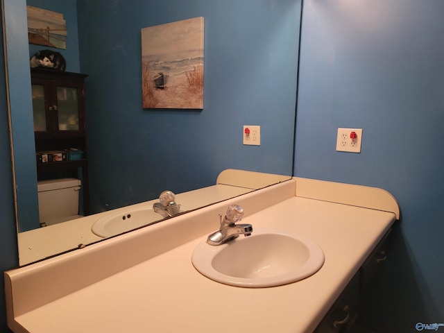 bathroom with vanity and toilet