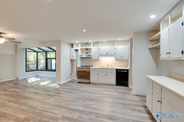 kitchen with stainless steel range oven, sink, white cabinetry, black dishwasher, and light hardwood / wood-style floors