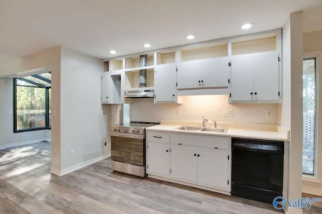 kitchen featuring sink, stainless steel electric range, dishwasher, white cabinets, and wall chimney range hood