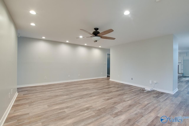 unfurnished room featuring ceiling fan and light hardwood / wood-style floors