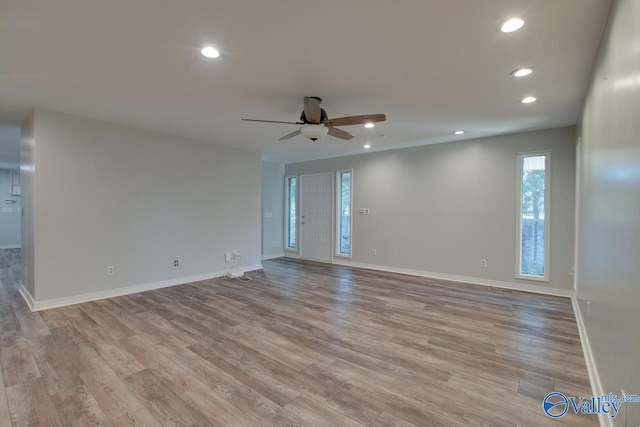 spare room with ceiling fan and light hardwood / wood-style flooring