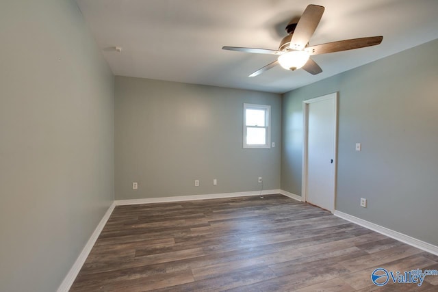 spare room featuring hardwood / wood-style flooring and ceiling fan