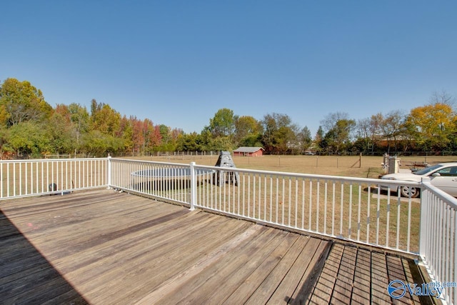 wooden terrace with a yard