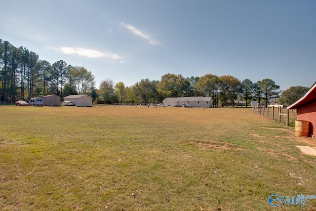 view of yard with a rural view