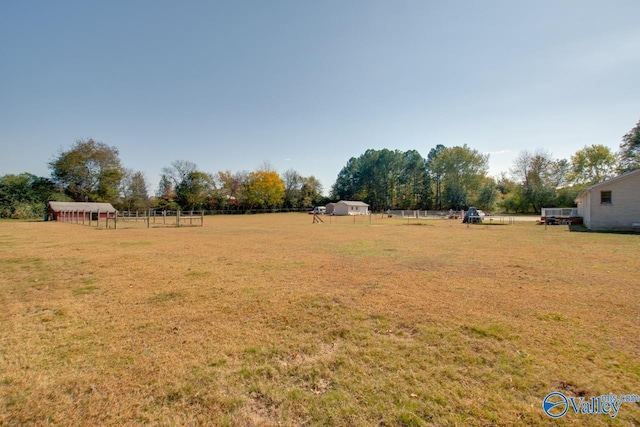 view of yard with a rural view