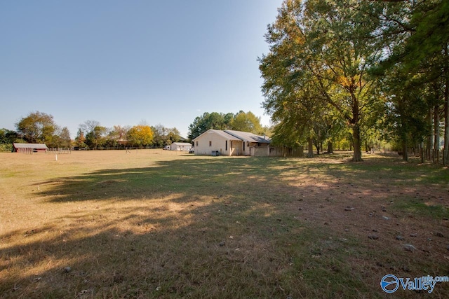 view of yard with a rural view