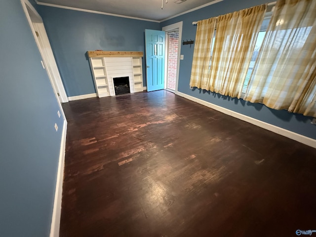 unfurnished living room with crown molding, a fireplace, and baseboards