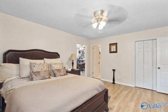 6304 Cedar Point Dr, Huntsville, AL 35810 - bedroom featuring light wood-style flooring, baseboards, a closet, and a ceiling fan