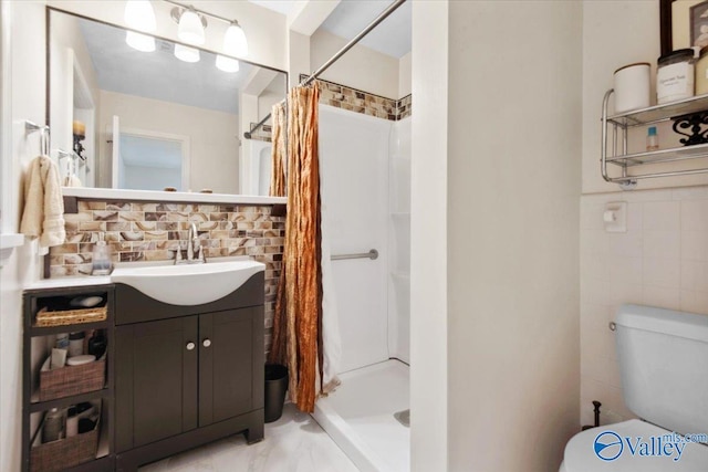 6304 Cedar Point Dr, Huntsville, AL 35810 - bathroom with vanity, a stall shower, toilet, tasteful backsplash, and tile walls