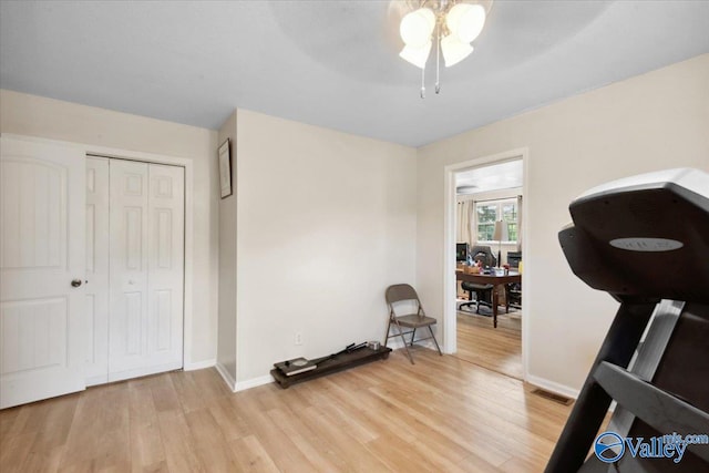 6304 Cedar Point Dr, Huntsville, AL 35810 - workout area featuring light wood-type flooring, ceiling fan, and baseboards