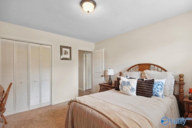 6304 Cedar Point Dr, Huntsville, AL 35810 - bedroom with carpet floors, baseboards, a closet, and a textured ceiling