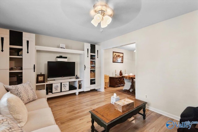 6304 Cedar Point Dr, Huntsville, AL 35810 - living area featuring ceiling fan, wood finished floors, and baseboards