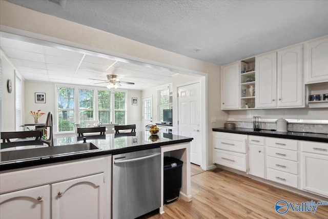 6304 Cedar Point Dr, Huntsville, AL 35810 - kitchen with dishwasher, open shelves, dark countertops, light wood-style floors, and a sink