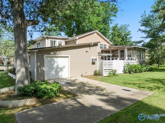 6304 Cedar Point Dr, Huntsville, AL 35810 - view of front of home featuring a sunroom, concrete driveway, a front lawn, and a garage